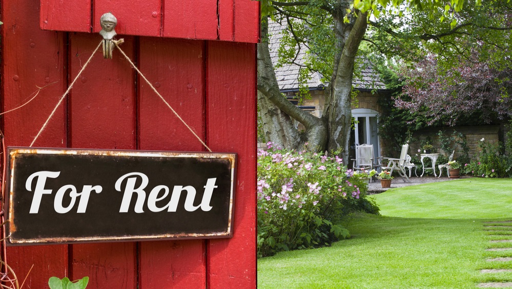 Garden with for rent sign on the gate