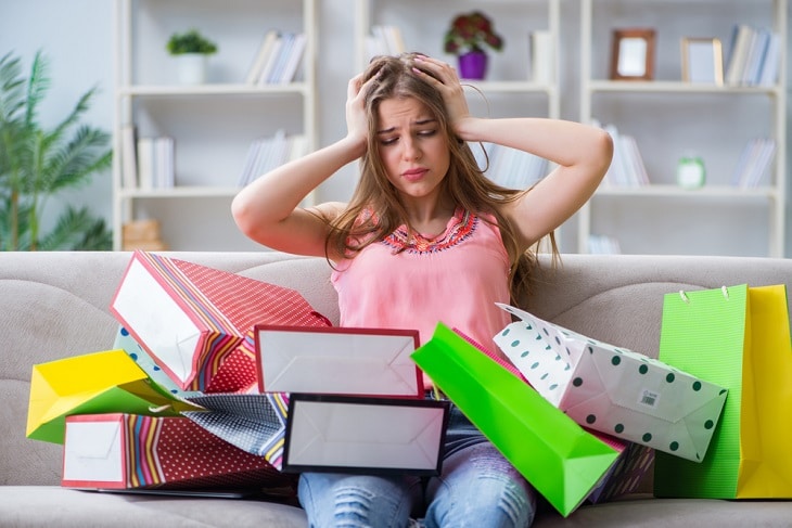 Distressed woman after spending too much shopping