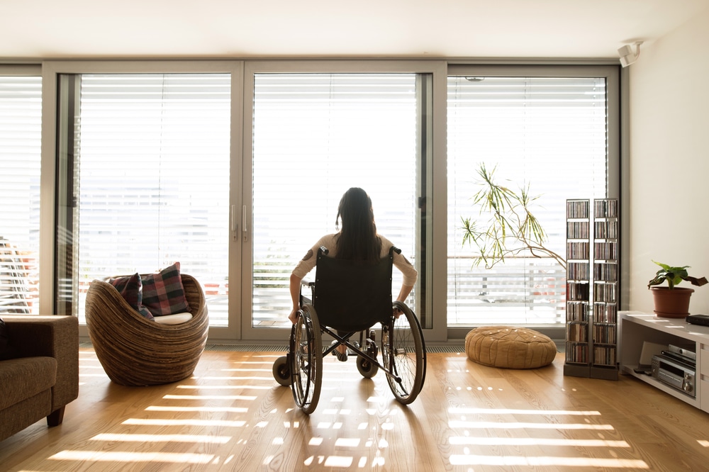 Woman in wheelchair at home