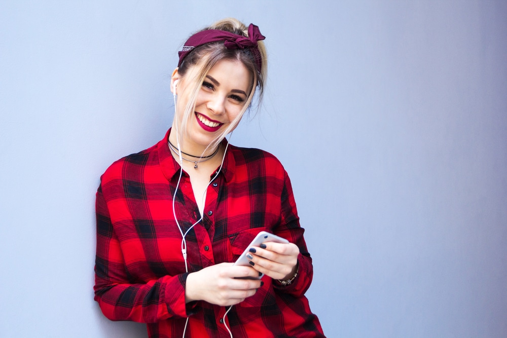 Woman listening to music on a mobile phone