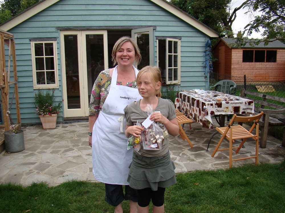 Dawn and Hannah in front of their shed