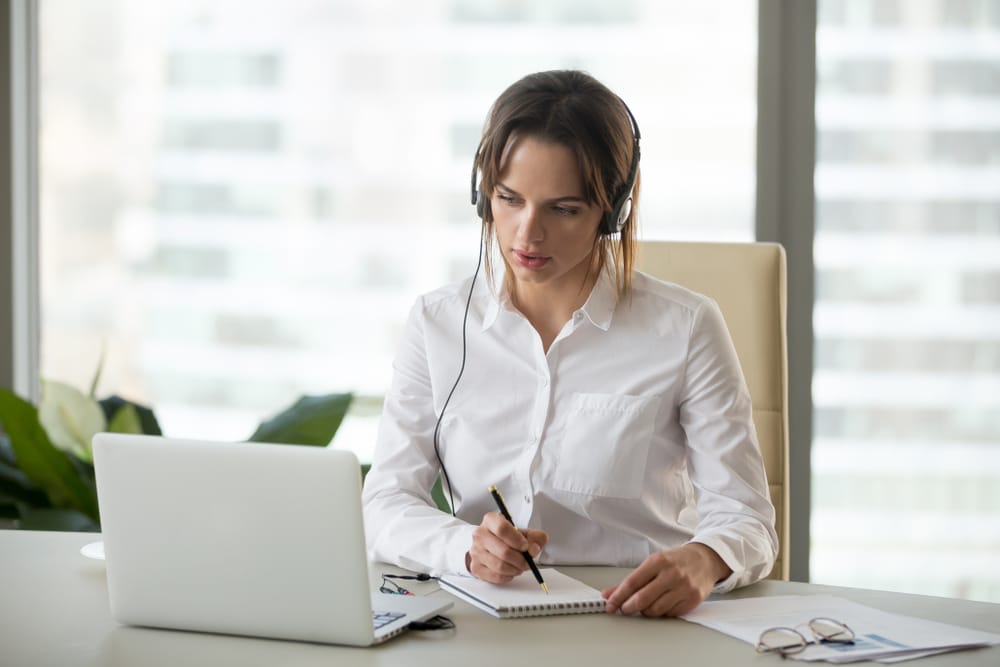 woman with laptop and headphones 